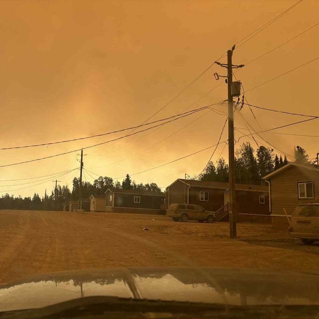 Smoke from wildfires is shown at Sandy Lake First Nation, Ont., in this Saturday, June 7, 2025 handout photo. THE CANADIAN PRESS/Handout - Destiny Rae *MANDATORY CREDIT*