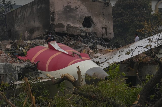 Parts of an Air India plane that crashed on Thursday are seen on top of a building in Ahmedabad, India, on June 13, 2025.