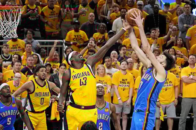 Jun 11, 2025; Indianapolis, Indiana, USA; Indiana Pacers center Tony Bradley (13) and Oklahoma City Thunder forward Chet Holmgren (7) go for the ball in game three of the 2025 NBA Finals at Gainbridge Fieldhouse. Mandatory Credit: Kyle Terada-Imagn Images