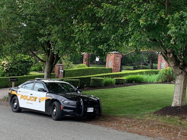  A police car outside the Abbotsford home of Satwinder Sharma. The businessman was shot to death at his office in Surrey on Wednesday.