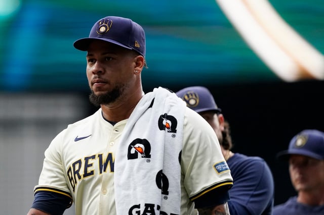 Milwaukee Brewers&#39; Frankie Montas walks from the bullpen to the dugout before a baseball game against the Los Angeles Dodgers, Wednesday, Aug. 14, 2024, in Milwaukee. (AP Photo/Aaron Gash)