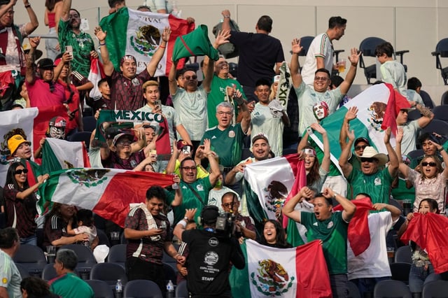 Fans of the Mexican national soccer team cheer in the stands during a Copa America Group B match against Venezuela in June 2024 at SoFi Stadium in Inglewood. (AP Photo/Mark J. Terrill)