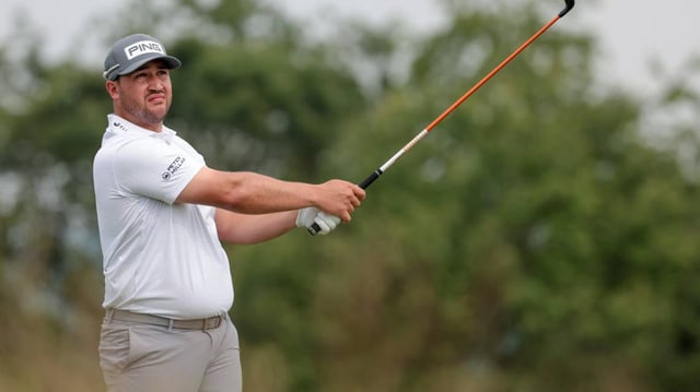 Thriston Lawrence plays his shot from the 16th tee during the second round of the U.S. Open golf tournament.