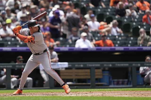 Casey Schmitt of the San Francisco Giants singles during a game against the Colorado Rockies at Coors Field on June 12, 2025 in Denver, Colorado. 