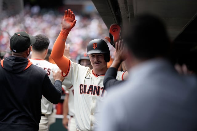 Matt Chapman #26 of the San Francisco Giants celebrates in the dugout after scoring a run during the game at Oracle Park on June 8, 2025 in San Francisco, California. 