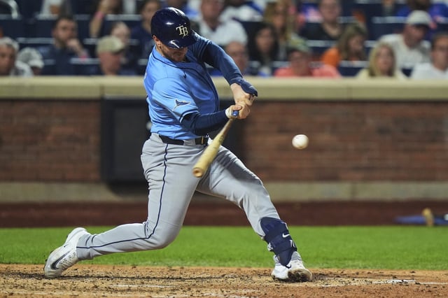 Tampa Bay Rays' Danny Jansen hits a two-run home run during the sixth inning of a baseball game against the New York Mets Friday, June 13, 2025, in New York. (AP Photo/Frank Franklin II)