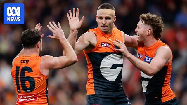 Jesse Hogan celebrates a goal with GWS teammates