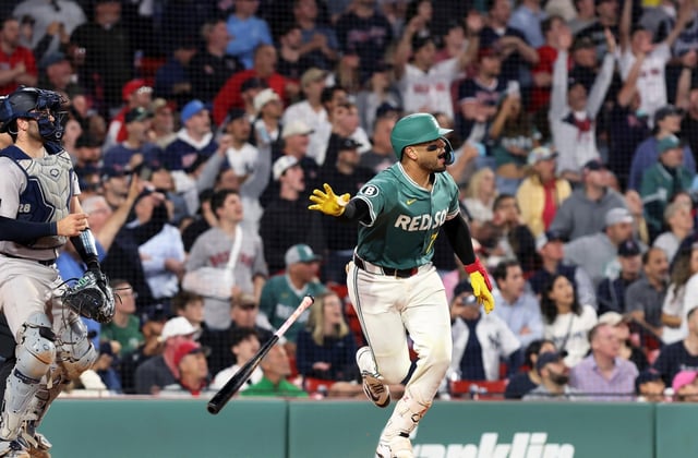 Boston Red Sox’s Carlos Narvaez flips his bat as he watches his winning hit in the bottom of the 10th inning during a baseball game against the New York Yankees, Friday, June 13, 2025, in Boston. (AP Photo/Jim Davis)