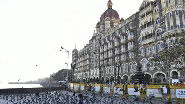 Mumbai, India - January 27, 2016: Kids playing with pigeons at Gateway of India, near Taj Mahal Palace Hotel in Mumbai, India, on Wednesday, January 27, 2016. (Photo by Aalok Soni/ Hindustan Times) (Hindustan Times)