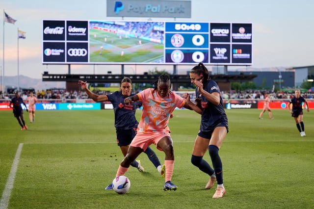 Jun 13, 2025; San Jose, California, USA; Orlando Pride forward Barbra Banda (22) controls the ball against Bay FC forward Karlie Lema (5) during the second half at PayPal Park. Mandatory Credit: Robert Edwards-Imagn Images