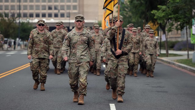 U.S. Army soldiers march in formation as they conduct drills ahead of tomorrow's 250th anniversary parade on June 13, 2025 in Washington, DC. (Photo by Kayla Bartkowski / GETTY IMAGES NORTH AMERICA / Getty Images via AFP)