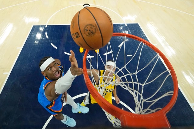 Oklahoma City Thunder guard Shai Gilgeous-Alexander shoots the ball against the Indiana Pacers during the first half of Game 4.