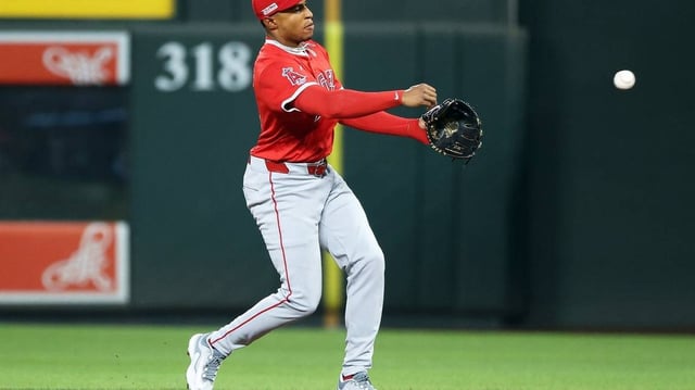 Jun 13, 2025; Baltimore, Maryland, USA; Los Angeles Angels second baseman Christian Moore (4) throws to first for an out during the first inning against the Baltimore Orioles at Oriole Park at Camden Yards. Mandatory Credit: Daniel Kucin Jr.-Imagn Images