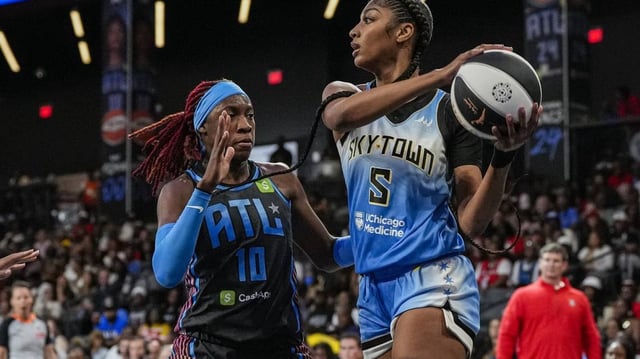 Chicago Sky forward Angel Reese (5) tries to pass defended by Atlanta Dream guard Rhyne Howard (10).