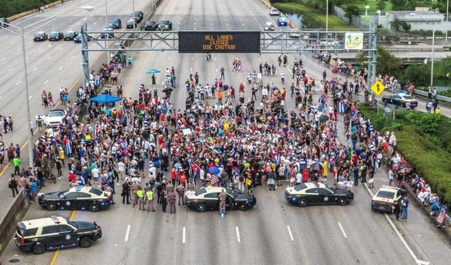 Cuban exiles blocked the Palmetto Expressway north and southbound at Coral Way in support of protesters in Cuba as thousands of Cubans took to the streets in the island to complain about a lack of freedom and a worsening economic situation, in 2021. (Pedro Portal//Miami Herald/TNS)