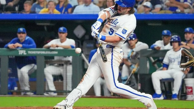 Jun 13, 2025; Kansas City, Missouri, USA; Kansas City Royals first base Vinnie Pasquantino (9) hits a single against the Athletics in the sixth inning at Kauffman Stadium. Mandatory Credit: Denny Medley-Imagn Images