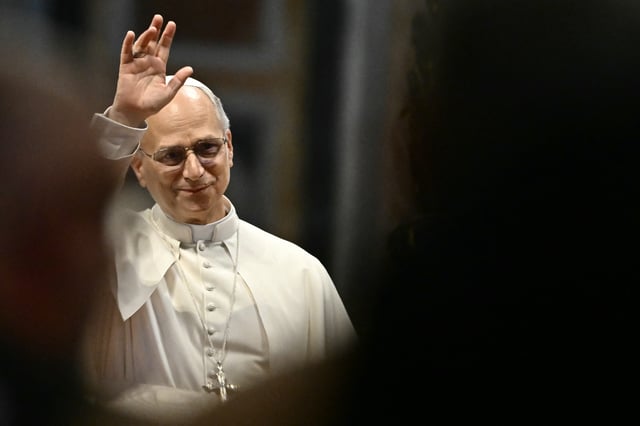 Pope Leo XIV waves at the end of a Jubilee audience on June 14, 2025 at St Peter's basilica in The Vatican. He appealedfor Iran and Israel to act with "reason" after airstrikes between the two countries killed dozens and sent civilians into shelters.