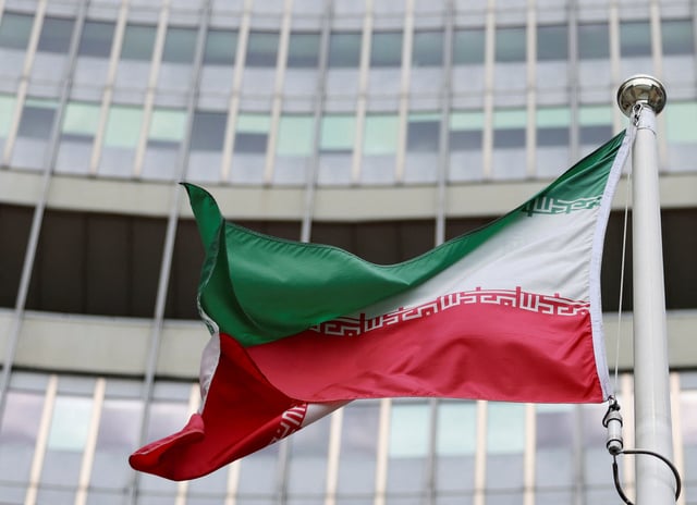 The Iranian flag flutters outside the IAEA headquarters after the first day of the agency's quarterly Board of Governors meeting at the IAEA headquarters in Vienna, Austria, June 9, 2025. REUTERS/Lisa Leutner