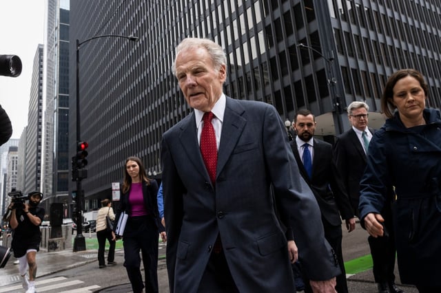 Flanked by attorneys and supporters, Illinois&#39; former House Speaker Michael Madigan walks out of the Dirksen Federal Courthouse after being sentenced to 7 1/2years in prison and fined $2.5 million on federal corruption charges, Friday, June 13, 2025. (Ashlee Rezin/Chicago Sun-Times via AP)