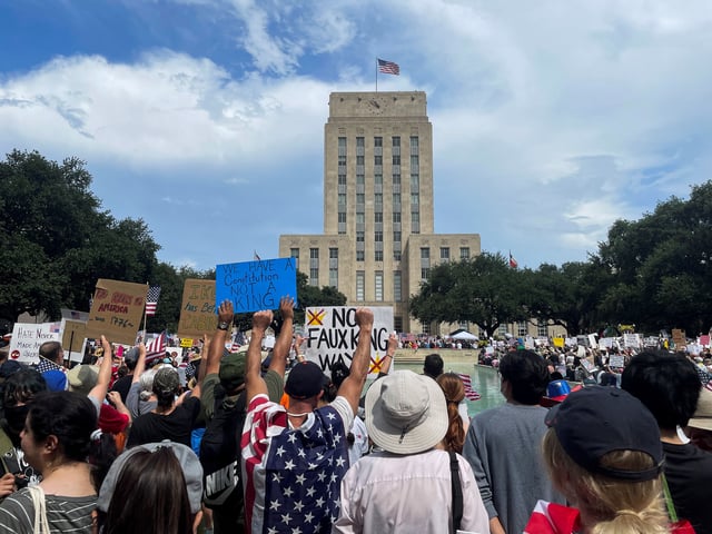People gather outside Houston city hall for "No Kings" rally, in Houston, Texas, U.S. June 14, 2025. REUTERS/Arathy Somasekhar