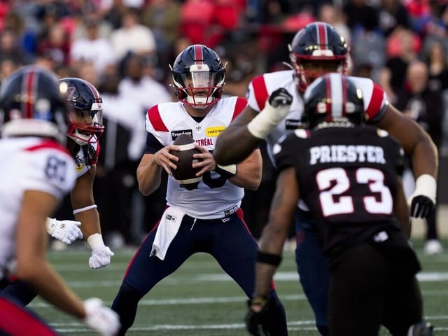 Redblacks defensive back Robert Priester (23) tries to apply pressure on Alouettes quarterback Davis Alexander (10) as he tries to pass in the first half of Fridays CFL game.