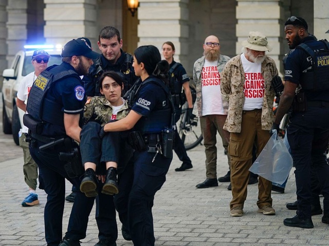WASHINGTON, DC - JUNE 13: U.S. Capitol Police react to demonstrators breaching a U.S. Capitol barrier during a protest against the upcoming parade for the Army’s 250th anniversary, which falls on President Donald Trump's birthday, on June 13, 2025 in Washington, DC. (Photo by Leigh Vogel/Getty Images for About Face: Veterans Against the War)
