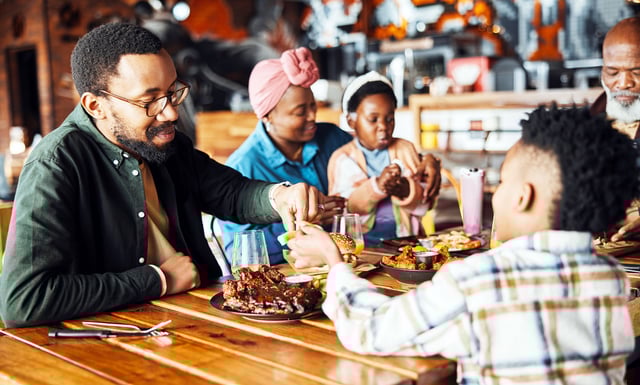 Family restaurant and food share with dad and child together.