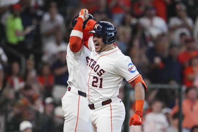 Houston Astros Yainer Diaz, right, celebrates with Jeremy Peña after hitting a two-run home run during the third inning of an MLB baseball game in Houston, Saturday, June 14, 2025.
