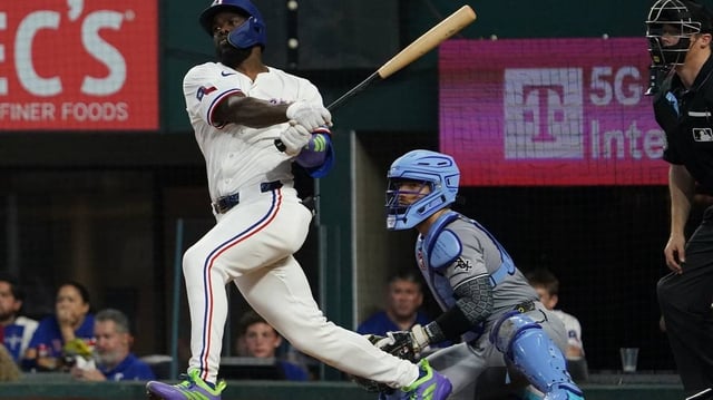 Jun 14, 2025; Arlington, Texas, USA; Texas Rangers outfielder Adolis García (53) hits a single during the sixth inning against the Chicago White Sox at Globe Life Field. Mandatory Credit: Raymond Carlin III-Imagn Images
