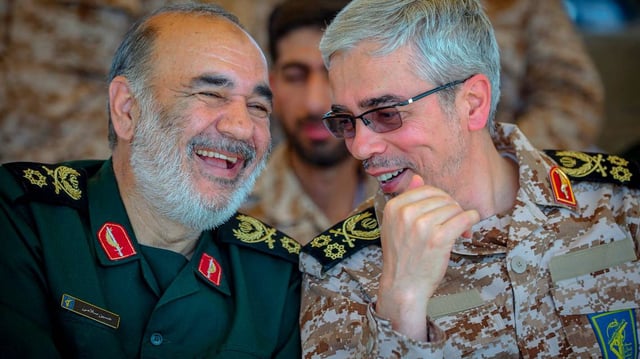 Brigadier General Mohammad Bagheri, the deputy chief of staff of Iran’s armed forces, right, and Brigadier General Hossein Salami, commander in chief of IRGC, during the Great Prophet joint military drill of Iran’s armed forces in Saravan, Iran, on April 12, 2016. (Armin Karami/Middle East Images/AFP/Getty Images)