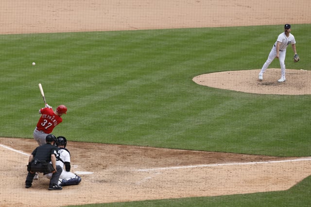 Jun 14, 2025; Detroit, Michigan, USA;  Cincinnati Reds designated hitter Tyler Stephenson (37) hits a double off Detroit Tigers catcher Jake Rogers (34) in the ninth inning at Comerica Park. Mandatory Credit: Rick Osentoski-Imagn Images