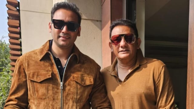 Mohammad Asaduddin poses for a photo with his father.