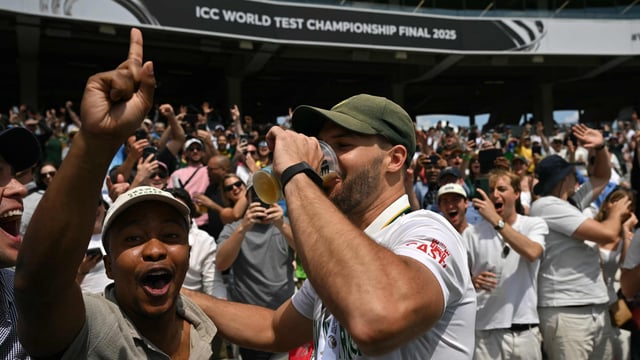 Aiden Markram enjoys a beer with a fan in the Lord's crowd, who he revealed to be a friend from school.