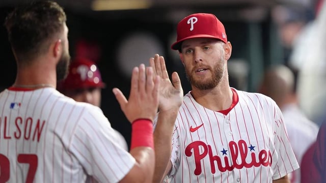 Jun 9, 2025; Philadelphia, Pennsylvania, USA; Philadelphia Phillies starting pitcher Zack Wheeler (45) reacts with teammates after recording his 1000th career strikeout against the Chicago Cubs in the fifth inning at Citizens Bank Park. Mandatory Credit: Kyle Ross-Imagn Images