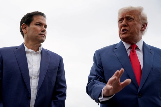 U.S. President Donald Trump stands with U.S. Secretary of State Marco Rubio as he prepares to depart for Hagerstown, Maryland, at Morristown Municipal Airport in Morristown, New Jersey, U.S., June 8, 2025. REUTERS/Nathan Howard/File Photo