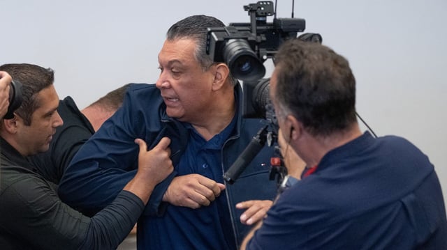 California Sen. Alex Padilla is pushed out of the room as Homeland Security Secretary Kristi Noem holds a news conference in Los Angeles on June 12. Photo: David Crane/MediaNews Group/Los Angeles Daily News via Getty Images