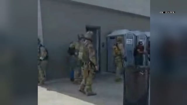Immigration officers raid the Santa Fe Springs Swap Meet on Saturday, June 14, 2025.