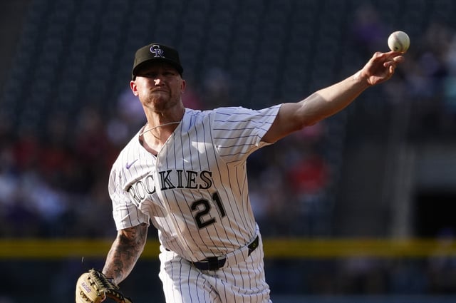 Jun 11, 2025; Denver, Colorado, USA; Colorado Rockies starting pitcher Kyle Freeland (21) delivers a pitch in the first inning against the San Francisco Giants at Coors Field. Mandatory Credit: Ron Chenoy-Imagn Images