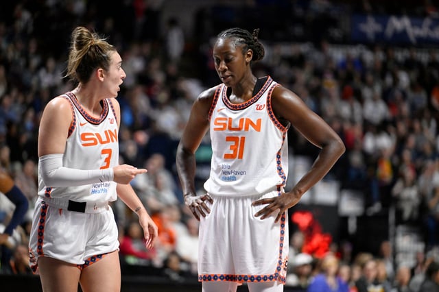 Connecticut Sun guard Marina Mabrey (3) talks with Connecticut Sun center Tina Charles (31) during the second half of WNBA game at Mohegan Sun in Uncasville, Conn., Tuesday, May 27, 2025. (Jessica Hill/Special to the Courant)