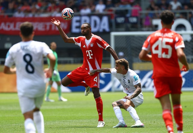Soccer Football - Club World Cup - Group C - Bayern Munich v Auckland City - TQL Stadium, Cincinnati, Ohio, U.S. - June 15, 2025 Bayern Munich's Jonathan Tah in action with Auckland City's Myer Bevan REUTERS/Kai Pfaffenbach