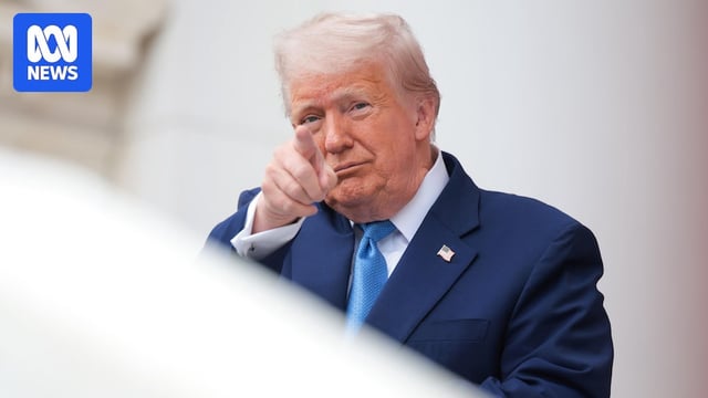 Donald Trump points at someone with his right hand index finger.