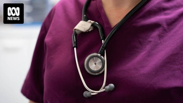 A female doctor carrying a stethoscope.