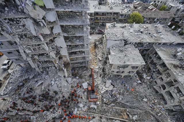 Israeli soldiers search through the rubble of residential buildings destroyed by an Iranian missile strike in Bat Yam, central Israel, on Sunday, June 15, 2025. (AP Photo/Baz Ratner)