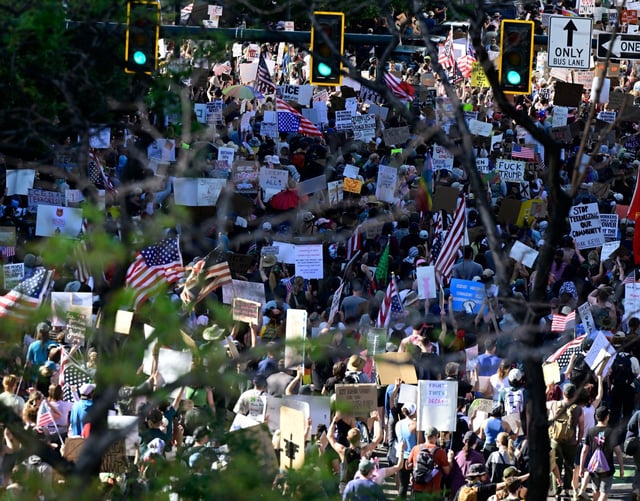 &#34;Ice Out, Stop the Deportations&#34; protesters march up Lincoln Street at 14th Avenue on their way back to the Capitol after marching to the Governor’s Mansion in Denver, on Saturday, June 14, 2025. Protesters gathered to rally against President Trump’s deportations and his administration’s policies. Earlier, thousands gathered for the &#34;No Kings&#34; rally as part of the national day of action against the Trump administration, which was scheduled at the same time as the U.S. Army’s parade in Washington, D.C. Saturday also marks Flag Day and President Trump’s 79th birthday. In addition to those to rallies, there was also an earlier &#34;All Out for Gaza, End the Genocide&#34; protest at the Capitol. (Photo by Andy Cross/The Denver Post)