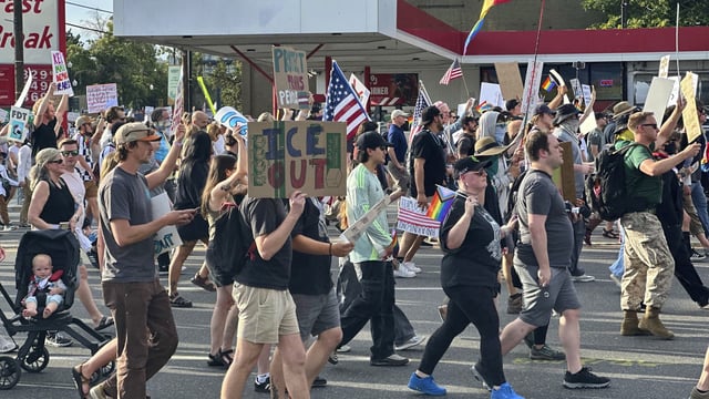 Demonstrators carry signs and chant while marching during a “No Kings” protest, Saturday, June 14, 2025, in Salt Lake City. (AP Photo/Amanda Barrett)