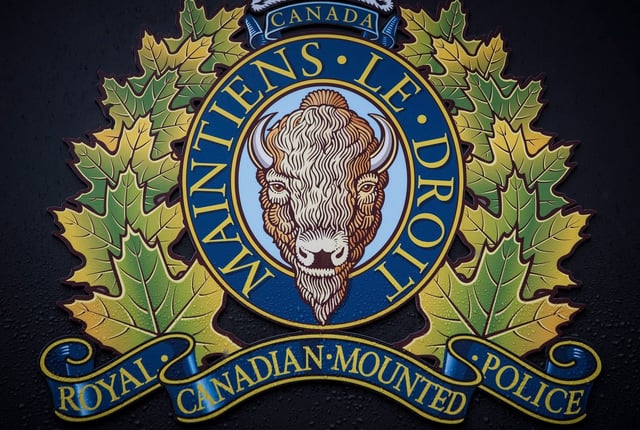 The RCMP logo is seen outside Royal Canadian Mounted Police "E" Division Headquarters, in Surrey, B.C., Friday, April 13, 2018. THE CANADIAN PRESS/Darryl Dyck