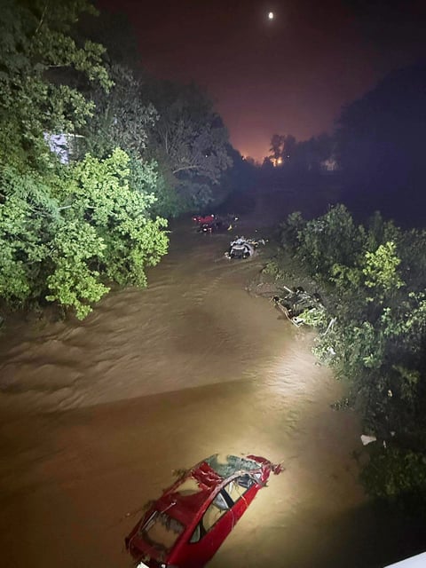 Cars sit submerged in floodwaters in Wheeling, West Virginia, on Saturday.