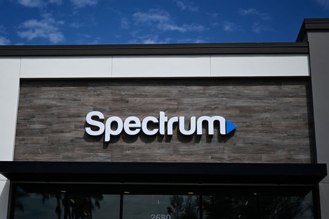The Spectrum logo is displayed outside one of the company's stores in Manhattan Beach, California, in 2023.