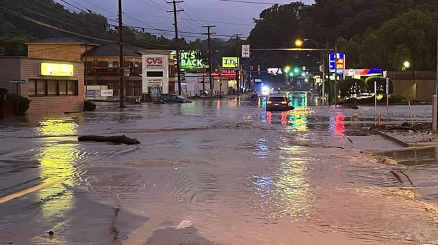 Officials closed this stretch of road in Wheeling, West Virginia, on Saturday night "because of the high water, mud and debris," the Wheeling, W.V., Fire Department said on Facebook. Photo: Wheeling, W.V., Fire Department/Facebook