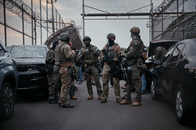 NEWARK, NEW JERSEY - JUNE 13: Federal Agents stand inside Delaney Hall Detention Facility on June 13, 2025 in Newark, New Jersey. Immigration and Customs Enforcement (ICE) protests have been spreading to cities across the nation after a series of immigration raids began last Friday, June 6th. (Photo by Andres Kudacki/Getty Images)